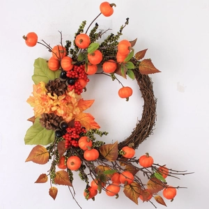 Autumn door wreath featuring sunflowers, pumpkins, berries and pine cones on grapevine