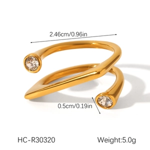Detailed view of an 18K gold-plated stainless steel spiral ring with cubic zirconia stones