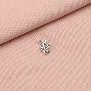 Detailed macro view of silver stainless steel grape pendant base for DIY jewelry making