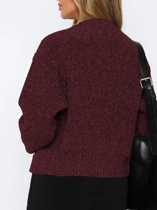 Detail view of wine red crewneck knit sweater with soft texture on female model back
