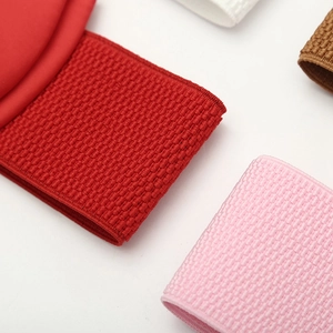 Detailed close-up of textured elastic corset belts in various vibrant fashion colors