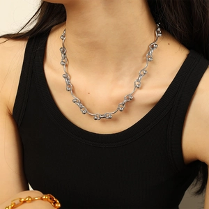 Chic silver stainless steel chain necklace with wavy metal bars and spherical beads