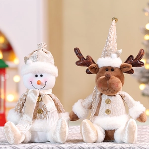 Detailed plush Christmas dolls in champagne gold and beige featuring a snowman and reindeer