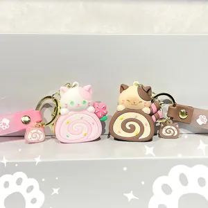 Cute cartoon cat cake roll keychains in pink and brown silicone with matching wrist straps