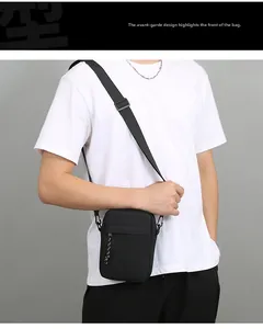 Detail view of durable black nylon crossbody bag with adjustable strap and paracord zip pulls