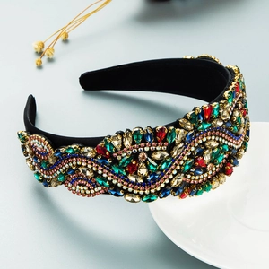 Detailed view of baroque headband featuring colorful crystals on black velvet base