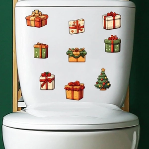 Christmas gift boxes and tree decorative stickers on a white toilet tank surface