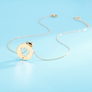 Minimalist gold stainless steel hollow angel necklace with a sparkling diamond accent