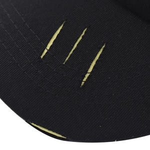 Close-up of black baseball cap brim featuring yellow triple scratch embroidery details