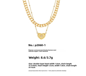 Detailed view of layered gold heart necklace featuring a cutout heart and Czech diamond