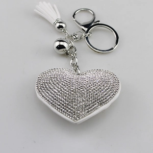 Sparkling silver heart keychain with rhinestone pavé and white leather tassel