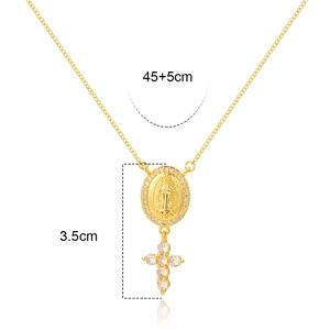 Detailed view of gold Virgin Mary medal and cross pendant with 3.5cm size dimensions