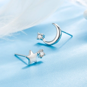 Elegant silver star and moon stud earrings with sparkling cubic zirconia crystals