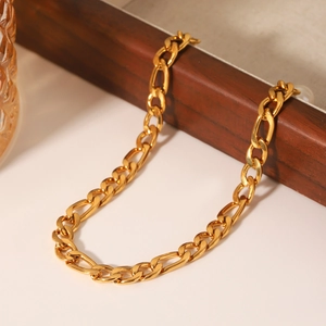 Gold plated stainless steel Figaro chain anklet with pearl charm on wooden jewelry box