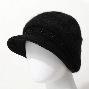 Detail of black faux fur knit beanie with brim, featuring stylish band and bead accents
