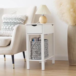 Macro view of hand-woven wicker storage basket inside a modern white bedside table shelf
