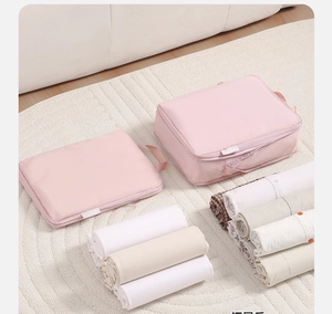 Pink nylon travel organizer bags set showing flat and filled storage capacity with clothes
