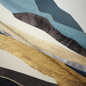 Detailed macro view of the short plush tapestry fabric with gold trim and mountain wave pattern