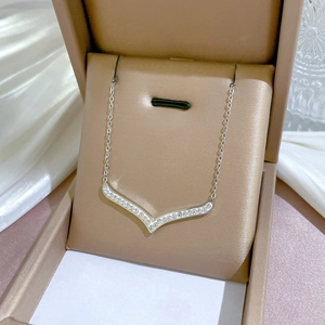 Minimalist silver V-shaped titanium steel necklace with crystals in a jewelry box