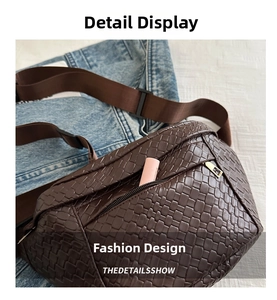 Detail of dark brown woven leather belt bag with zipper pocket and lipstick inside