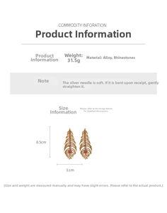 Detailed size view of vintage gold feather earrings with rhinestones and orange gems