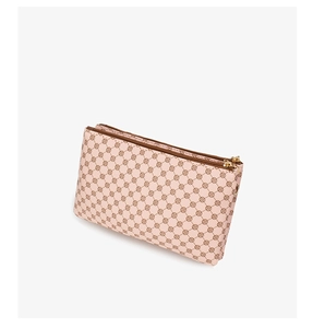 Detail showing dual gold zippers and pink logo pattern on the leather crossbody bag