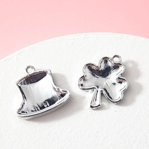 DIY silver alloy charms featuring clover and top hat designs for jewelry making