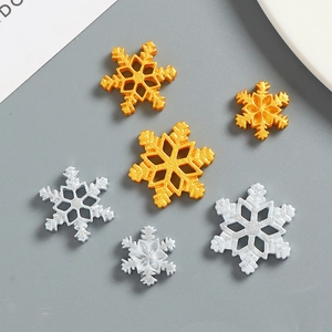 Golden and silver metal snowflake charms for DIY craft and phone case decoration