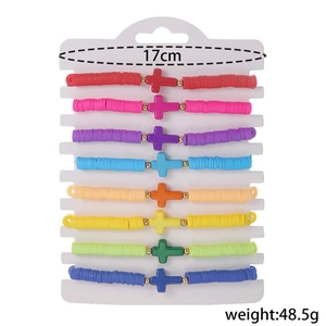 Eight-piece colorful clay bead cross bracelet set displayed on a 17cm white card base