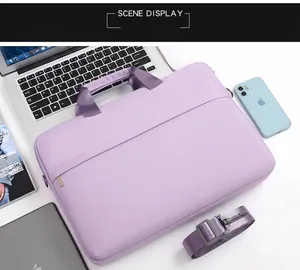 Purple 14-inch laptop bag with reinforced handles and detachable shoulder strap detail