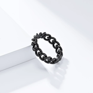 Minimalist black stainless steel Cuban link chain ring displayed on a white block
