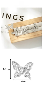 Macro view of French retro titanium butterfly earring with inlaid zircons and size display