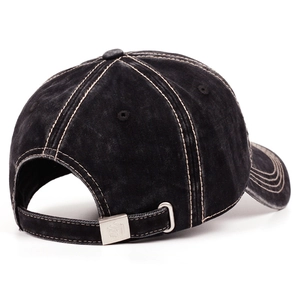 Macro view of adjustable silver metal buckle and contrast stitching on washed cotton cap