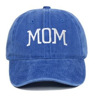 Close-up of white MOM embroidery on distressed navy blue washed cotton baseball cap