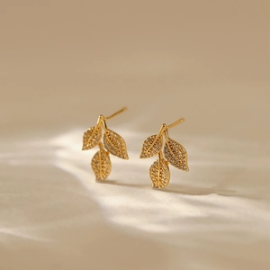 18K gold plated leaf stud earrings with pavé zircons in elegant matte gold finish
