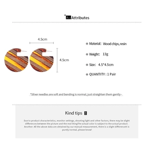 Detail showing wood and resin striped earrings with dimensions and material specs