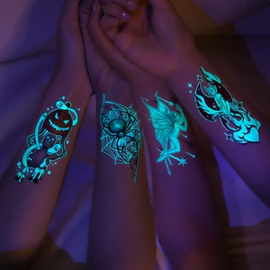 Luminous Halloween tattoos featuring blue glow spiders, pumpkins and ghosts on skin