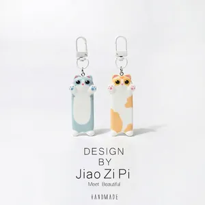 Cute cartoon hugging cat keychains in blue and orange with white metal hooks