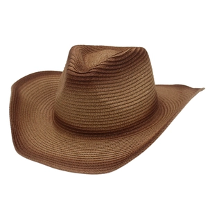 Detailed texture of a brown woven straw cowboy hat with a wide brim and classic crown