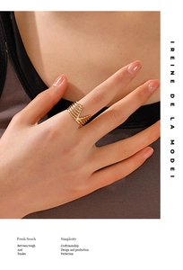 Close-up of a model wearing a hollow V-shaped gold plated stainless steel ring on her finger