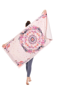 Macro view of quick-dry microfiber beach towel with pink mandala pattern and floral print