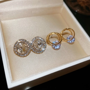 Close-up of sparkling cubic zirconia stud earrings in a luxury velvet jewelry box