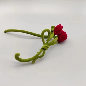 Elegant red tulip hair clip with green bow in flocked velvet finish for hair styling
