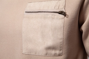 Detailed view of khaki knit sweatshirt with faux suede pocket and vintage metal zipper