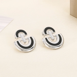 Minimalist silver D-shaped stainless steel earrings with black enamel inlay design