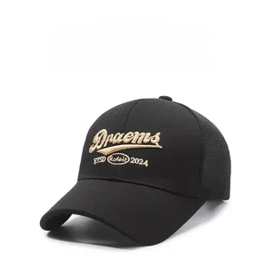 Detail of black breathable baseball cap featuring 3D gold embroidery and mesh eyelets