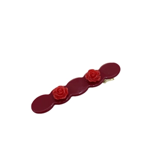 Vintage burgundy acetate hair clip with 3D rose flower accents on a wavy edge base