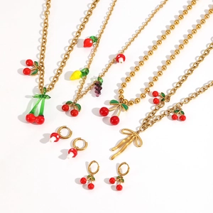 Golden stainless steel jewelry set featuring colorful cherry lemon and mushroom fruit pendants