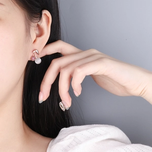 Sweet cherry stud earrings with red crystals and pearls in rose gold on model