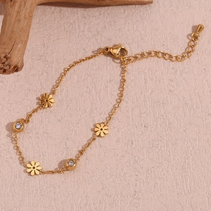 Detail of 18K gold floral bracelet with white rhinestones and adjustable lobster clasp